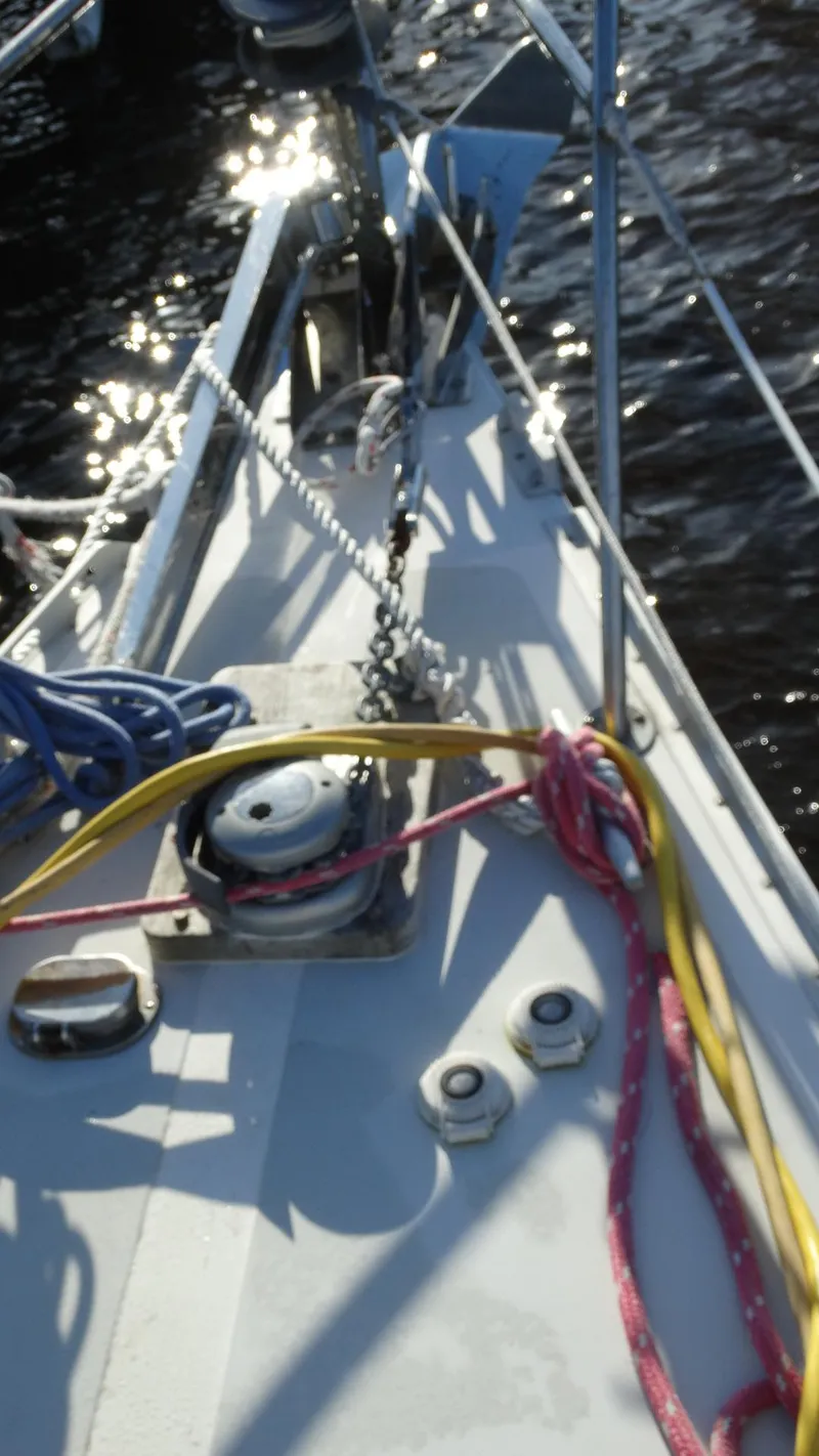 Slide: The Image of 1985 Gulfstar 45 Hirsch Center Cockpit sailboat deck with ropes and winch. - 7