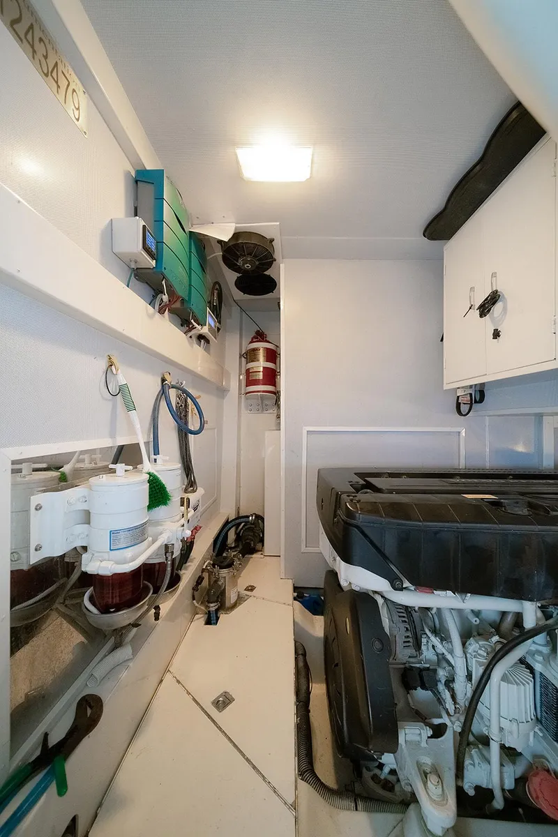 Slide: The Image of Engine room of 2013 Lazzara LSX yacht, featuring modern equipment and fire safety system. - 19