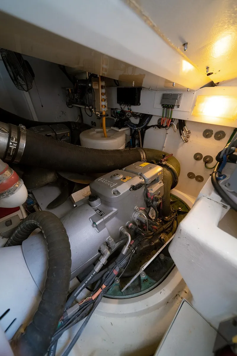 Slide: The Image of Engine room of 2013 Lazzara LSX yacht, showcasing mechanical components and wiring. - 21