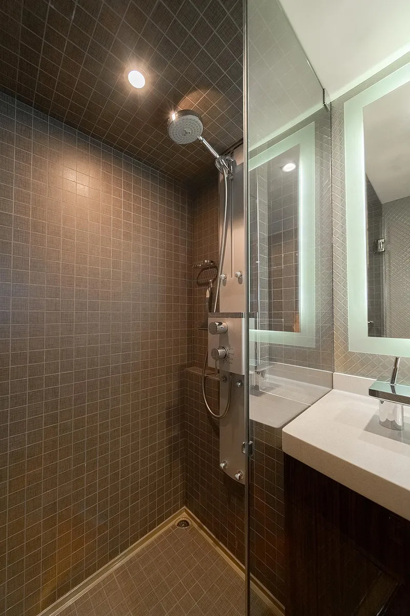 Slide: The Image of Luxurious bathroom in 2013 Lazzara LSX yacht with modern shower and illuminated mirror. - 23