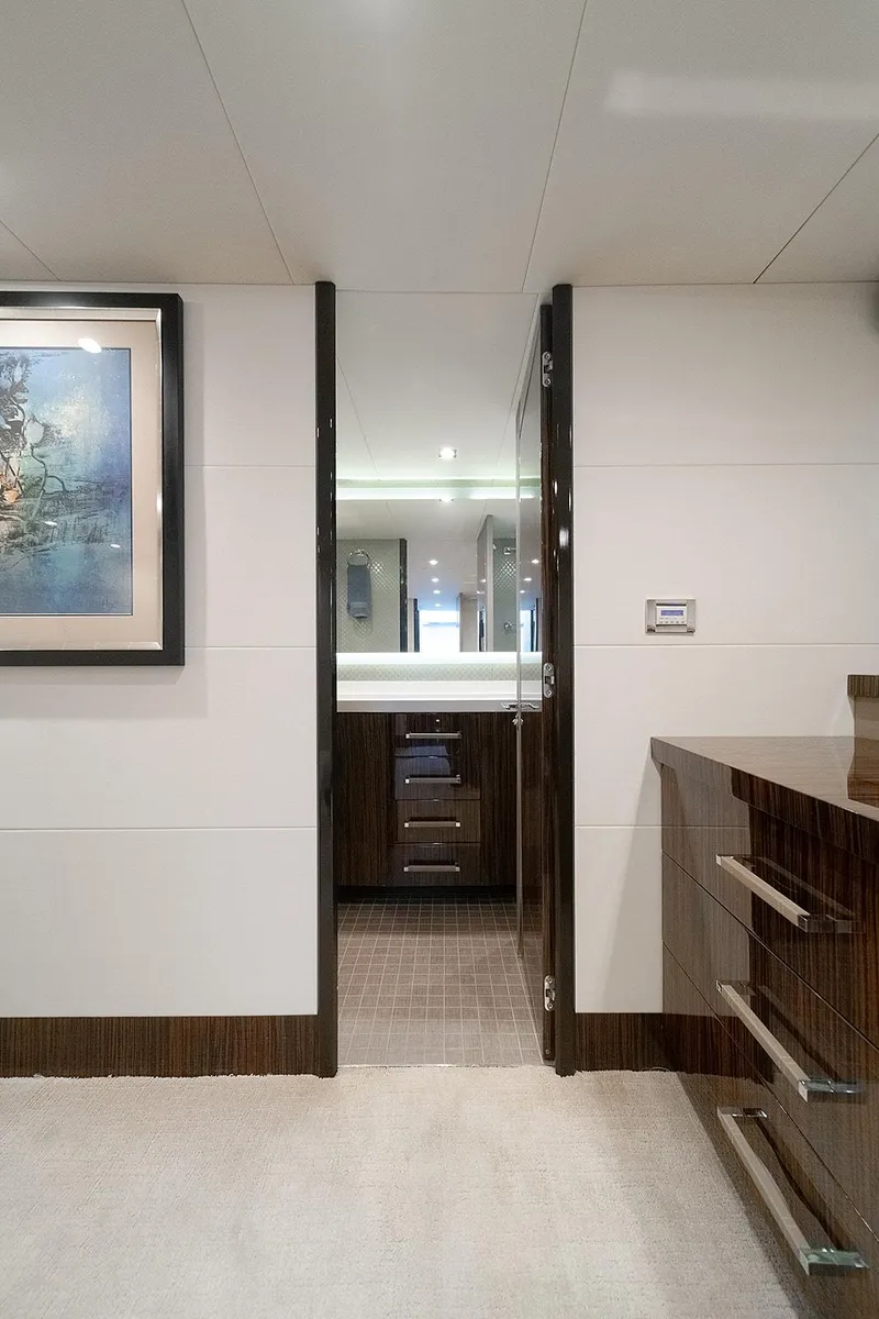 Slide: The Image of Interior of 2013 Lazzara LSX yacht, featuring modern design and elegant wood finishes. - 26