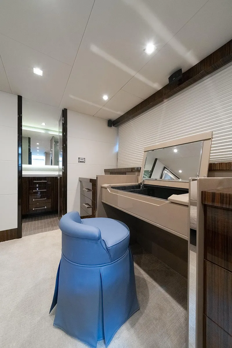 Slide: The Image of Luxurious interior of 2013 Lazzara LSX yacht with vanity and blue chair. - 27