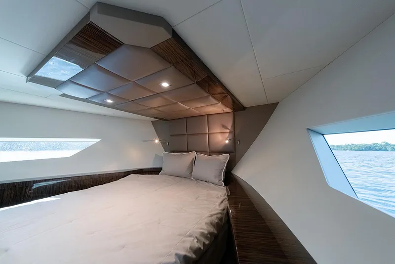 Slide: The Image of Luxurious 2013 Lazzara LSX yacht bedroom with modern design and scenic window views. - 34