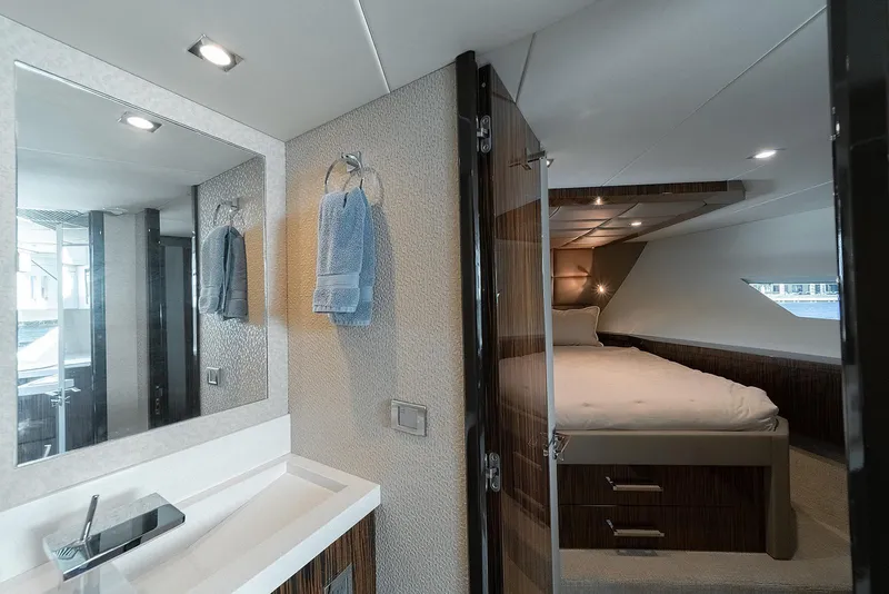 Slide: The Image of Luxurious interior of 2013 Lazzara LSX yacht featuring a modern bedroom and bathroom. - 36