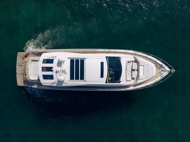 Slide: The Image of Aerial view of 2013 Lazzara LSX yacht cruising on clear water. - 4