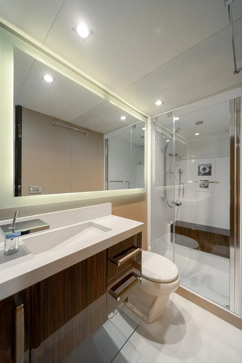 Slide: The Image of Luxurious bathroom in 2013 Lazzara LSX yacht with modern fixtures and glass shower. - 44
