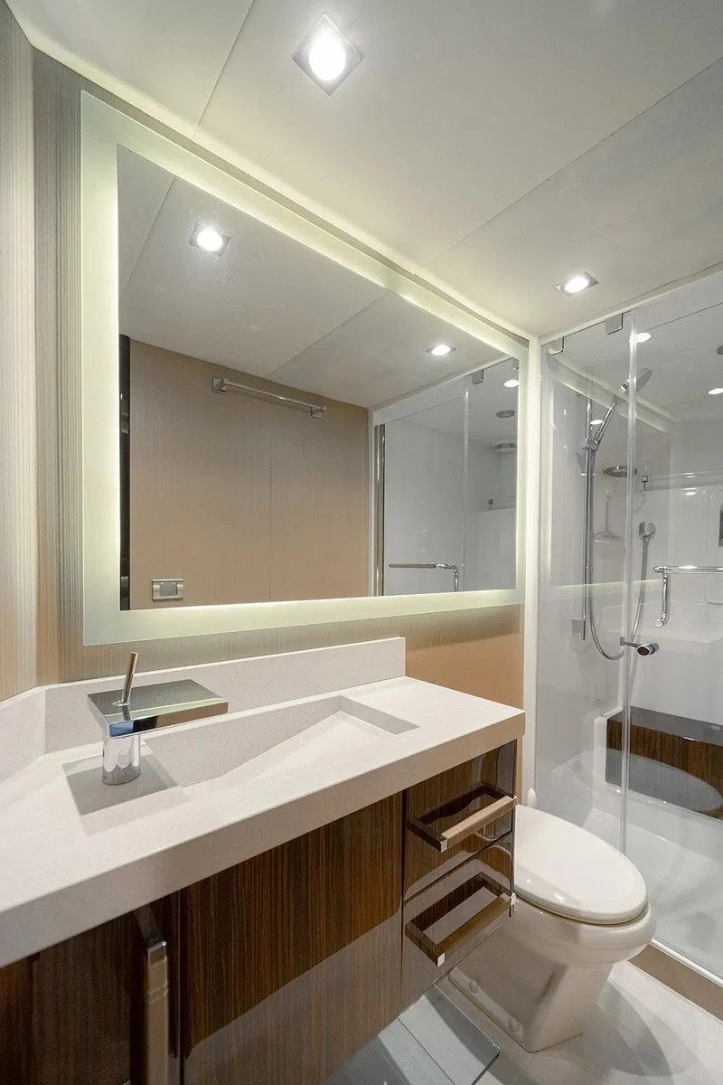 Slide: The Image of Modern bathroom on 2013 Lazzara LSX yacht with sleek fixtures and illuminated mirror. - 45