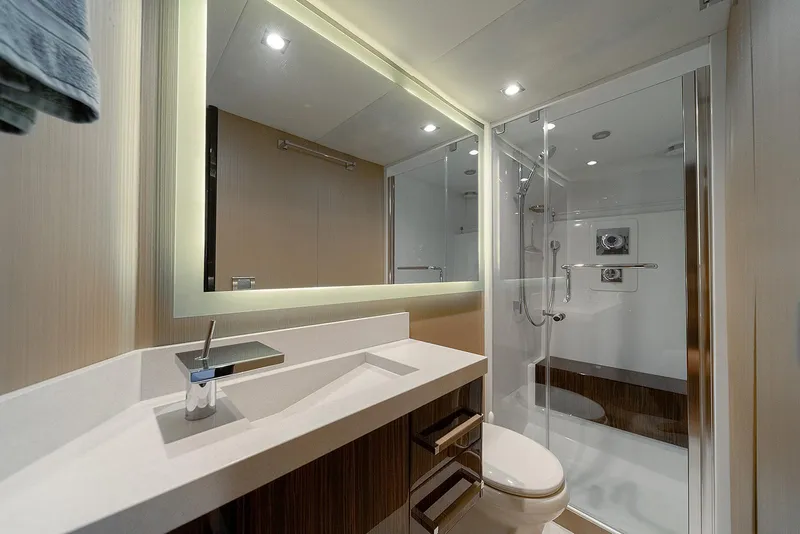 Slide: The Image of Luxurious bathroom in 2013 Lazzara LSX yacht with modern fixtures and glass shower. - 46
