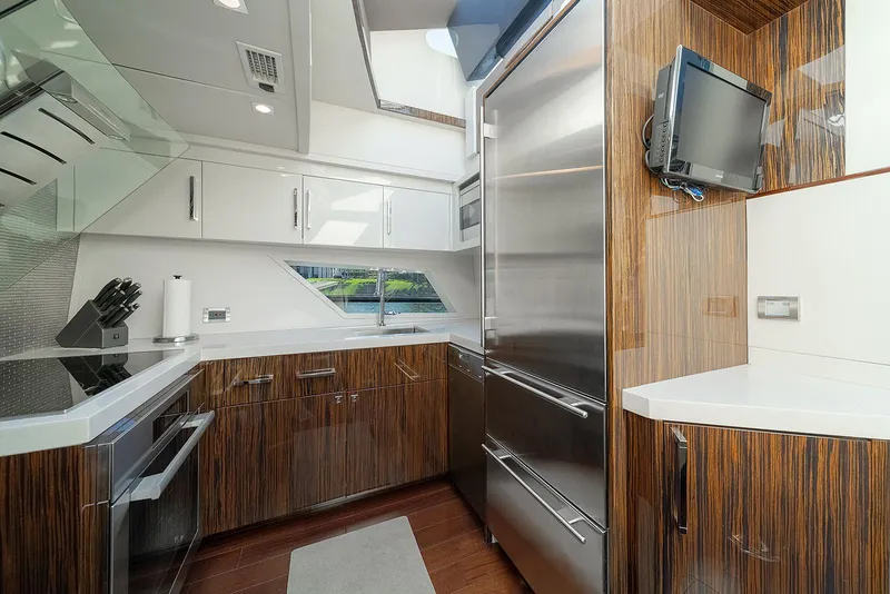 Slide: The Image of Luxurious kitchen interior of 2013 Lazzara LSX yacht with modern appliances and sleek wood finishes. - 47