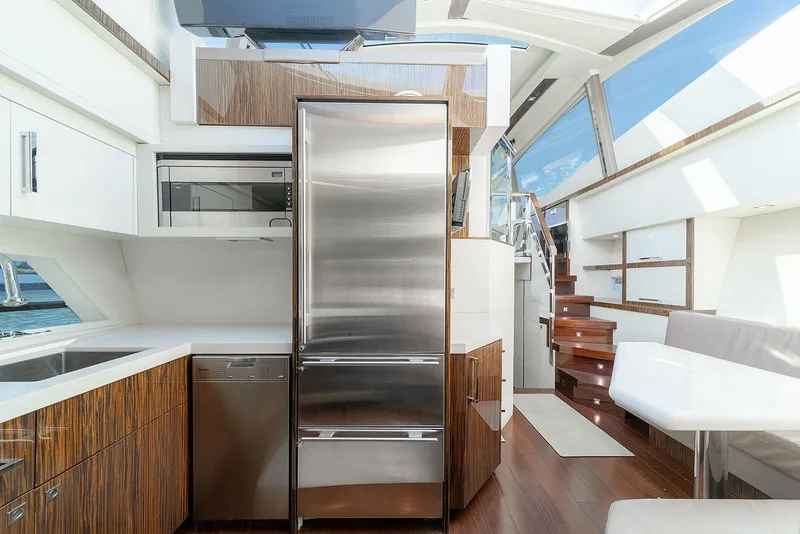 Slide: The Image of Luxurious 2013 Lazzara LSX yacht interior with modern kitchen and sleek design. - 49