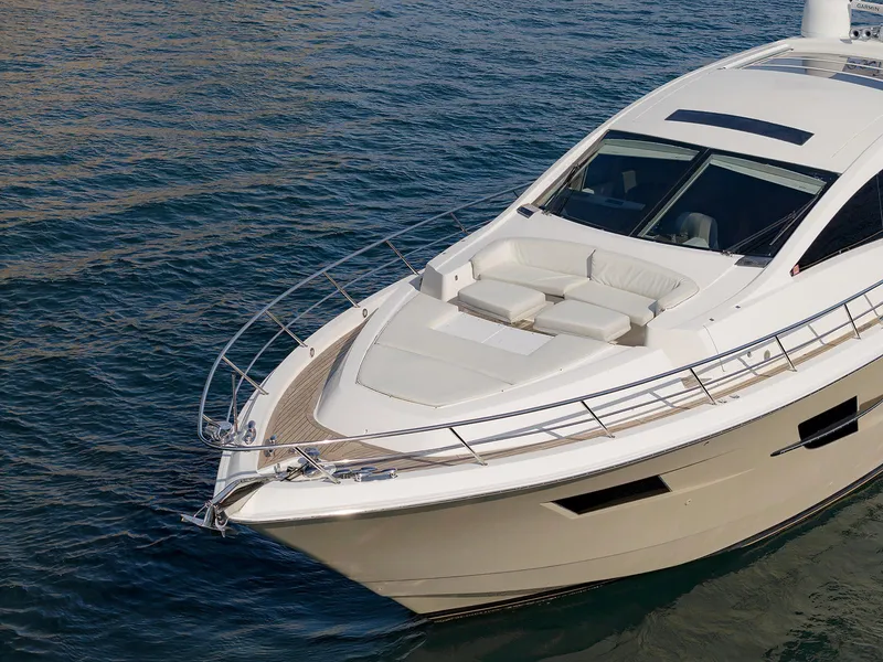 Slide: The Image of 2013 Lazzara LSX yacht on calm water, featuring sleek design and spacious deck. - 6