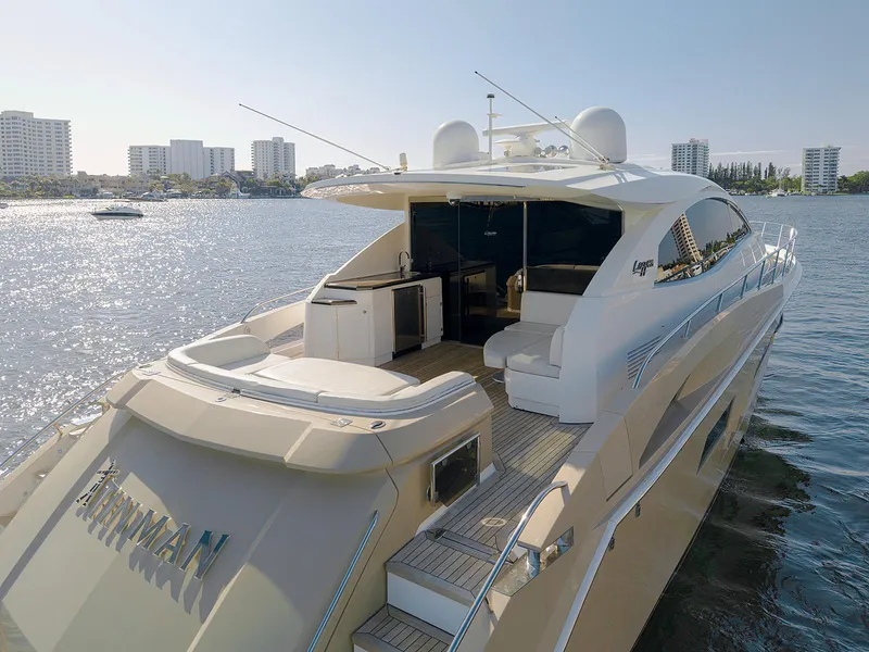 Slide: The Image of 2013 Lazzara LSX yacht on water, featuring sleek design and spacious deck area. - 8