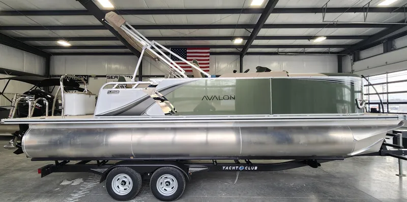 Slide: The Image of 2025 Avalon Platinum LSZ 2185 Cruise Rear Bench pontoon boat in a showroom. - 0