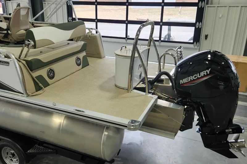 Slide: The Image of 2025 Avalon Platinum LSZ 2185 Cruise Rear Bench with Mercury outboard motor in showroom. - 11