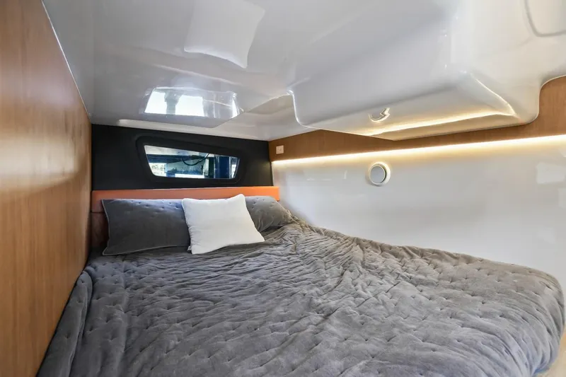 Slide: The Image of Luxurious cabin interior of 2025 Hanover 355 Outboard boat with cozy bedding. - 18