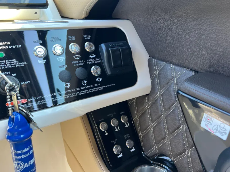 Slide: The Image of Control panel of 2022 Sea Ray SLX 250 boat with quilted upholstery detail. - 37