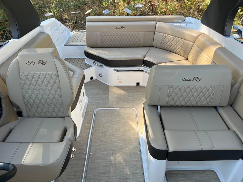 Slide: The Image of Luxurious interior of 2022 Sea Ray SLX 250 boat with beige leather seating. - 46