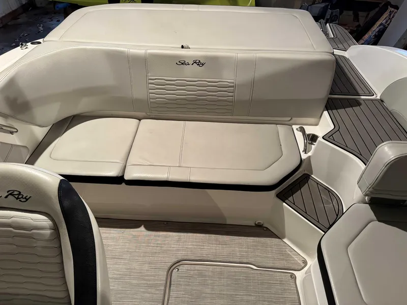 Slide: The Image of 2022 Sea Ray SPX 190 boat interior with beige seating and stylish design. - 7