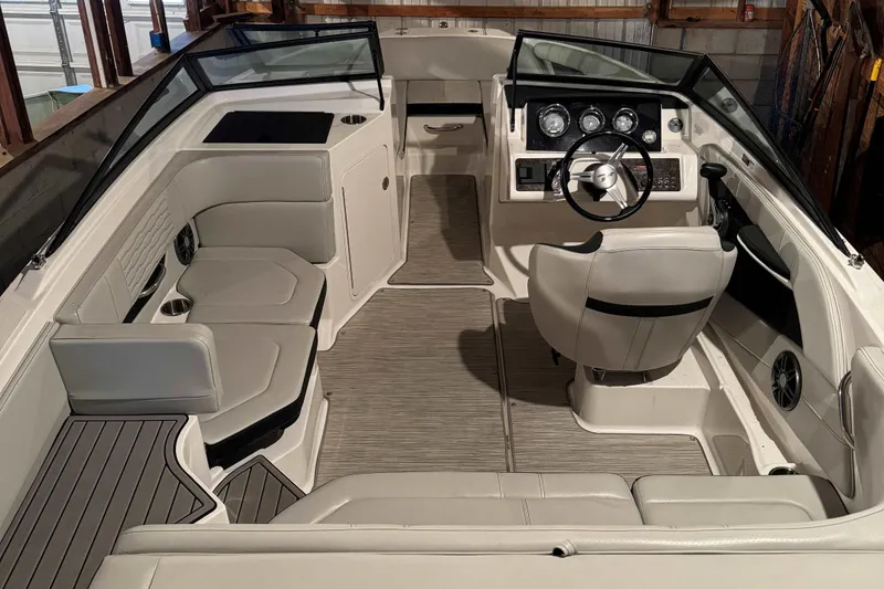 Slide: The Image of 2022 Sea Ray SPX 190 boat interior with modern dashboard and seating. - 9