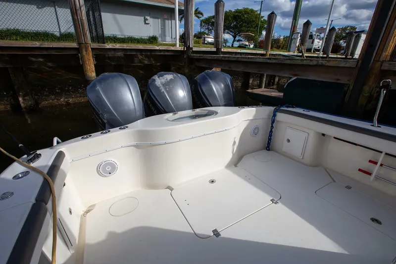 Slide: The Image of 2015 Yellowfin 39 Offshore boat with triple outboard engines docked at marina. - 6