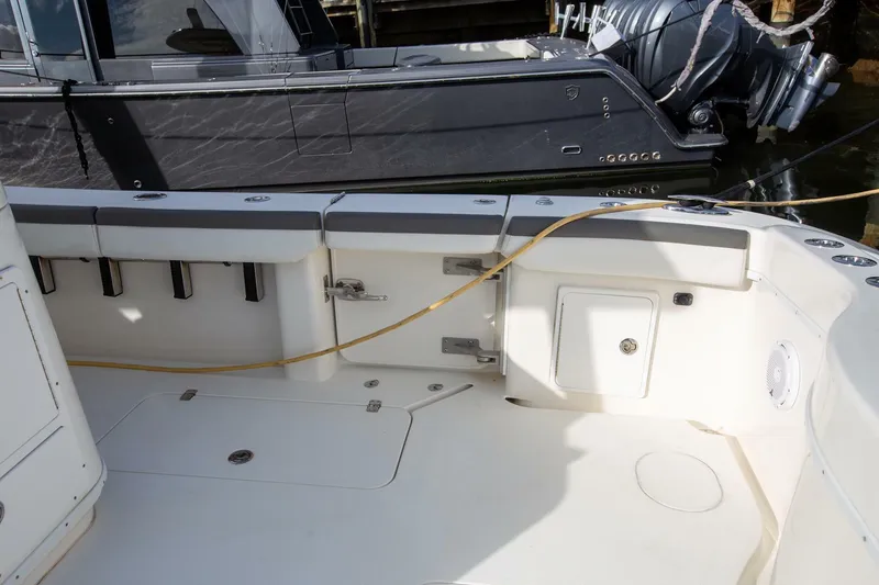 Slide: The Image of 2015 Yellowfin 39 Offshore boat deck with storage and seating. - 7