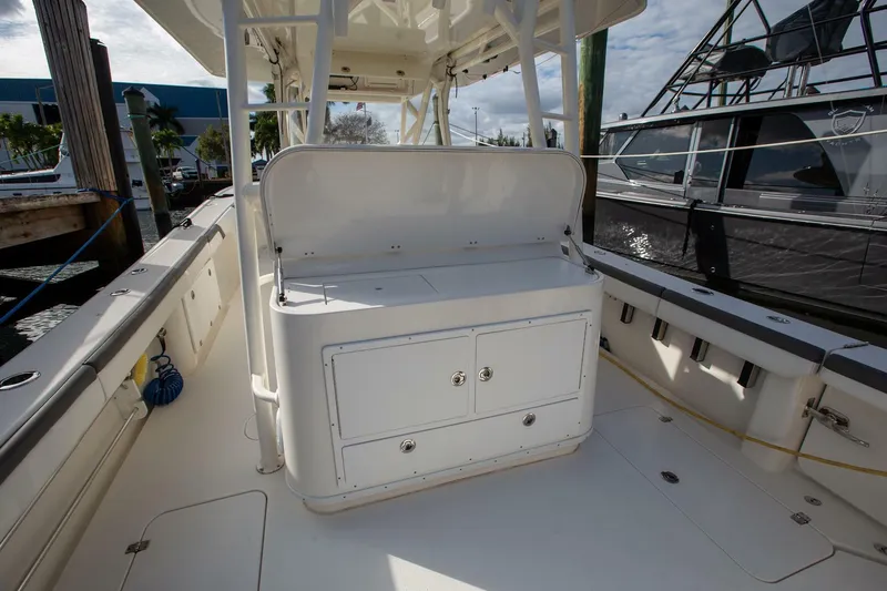 Slide: The Image of 2015 Yellowfin 39 Offshore boat interior with storage compartments. - 9