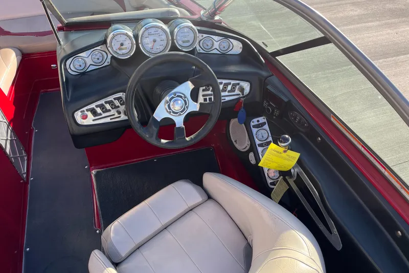 Slide: The Image of 2007 MasterCraft X2 boat dashboard with steering wheel and gauges. - 10