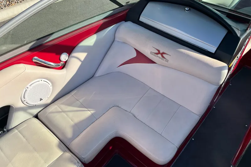 Slide: The Image of 2007 MasterCraft X2 boat interior with red and white seating. - 11