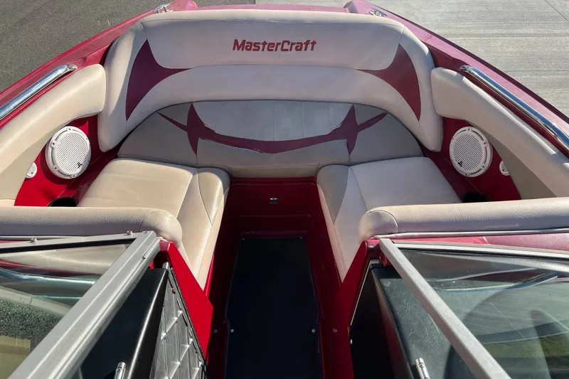Slide: The Image of 2007 MasterCraft X2 boat interior with red and beige seating. - 12