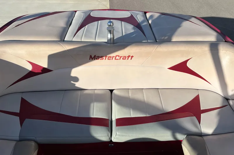 Slide: The Image of 2007 MasterCraft X2 boat interior with red and beige upholstery. - 14
