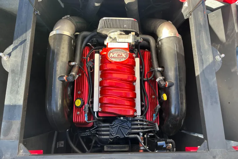 Slide: The Image of 2007 MasterCraft X2 engine with red components and black hoses. - 15