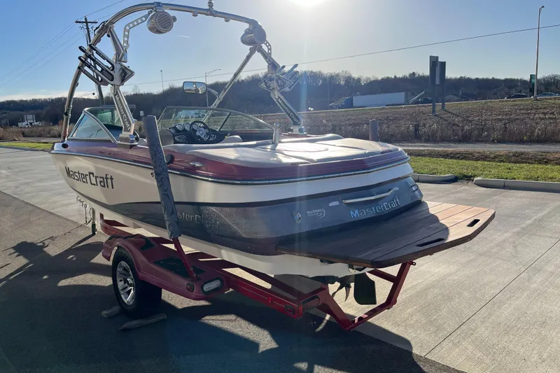 Slide: The Image of 2007 MasterCraft X2 boat on trailer in sunny outdoor setting. - 6