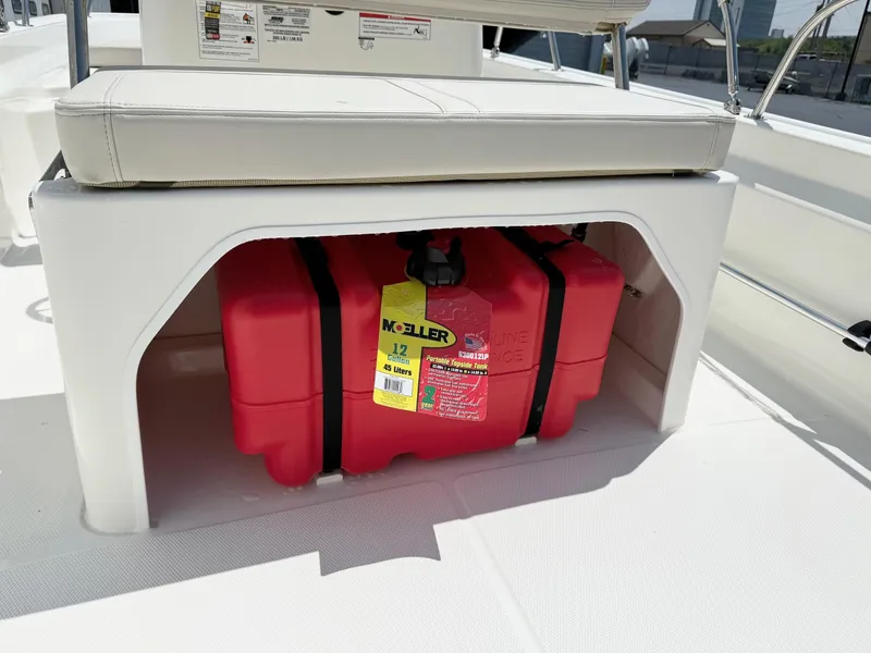 Slide: The Image of 2025 Boston Whaler 150 Montauk boat with red fuel tank under seat. - 8
