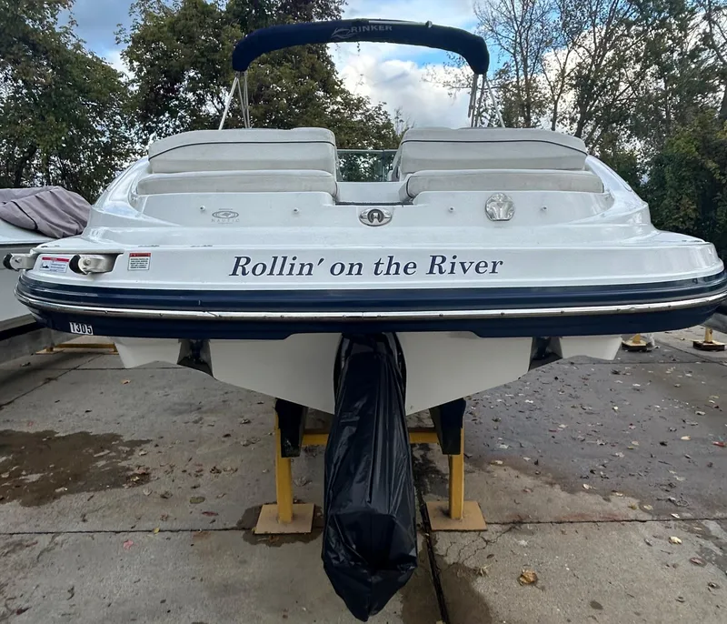 Slide: The Image of 2015 Rinker Captiva 276 BR boat named "Rollin' on the River" on a stand. - 10
