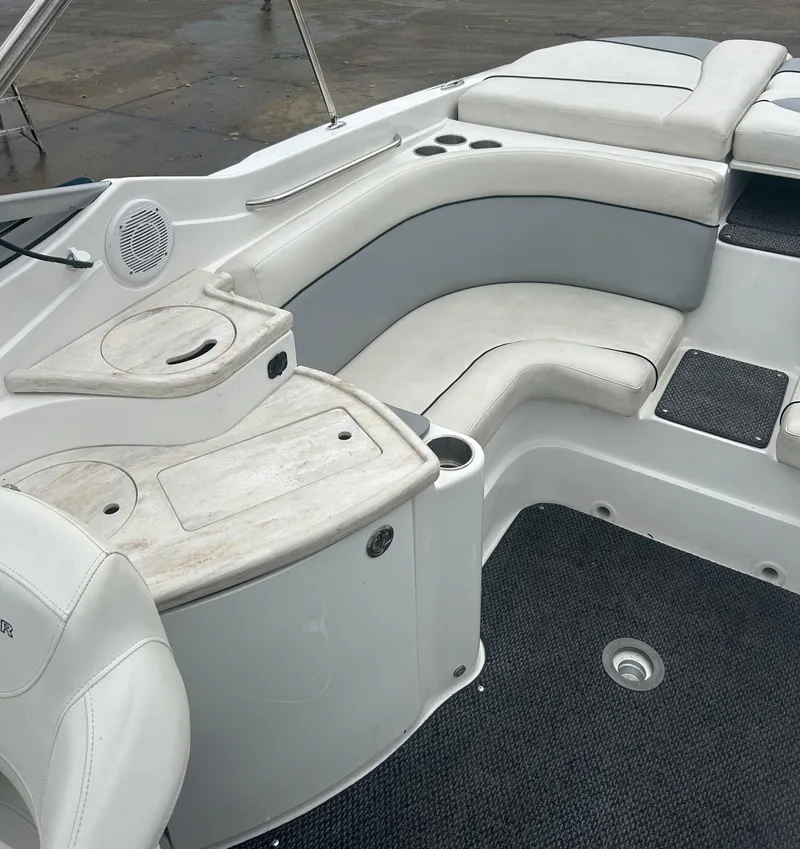 Slide: The Image of 2015 Rinker Captiva 276 BR boat interior with seating and storage. - 17