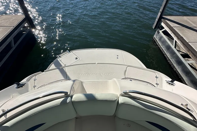 Slide: The Image of 2002 Chaparral 263 Sunesta boat docked on calm water. - 13