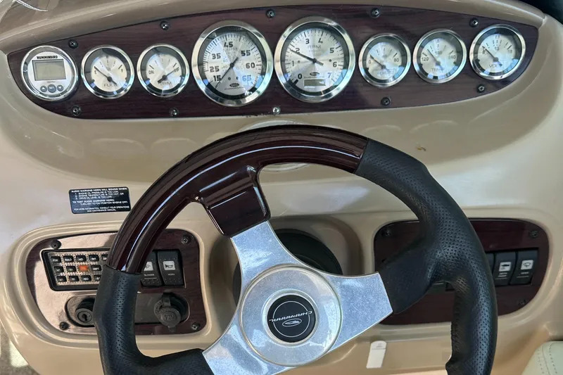 Slide: The Image of Dashboard of a 2002 Chaparral 263 Sunesta boat with gauges and steering wheel. - 20