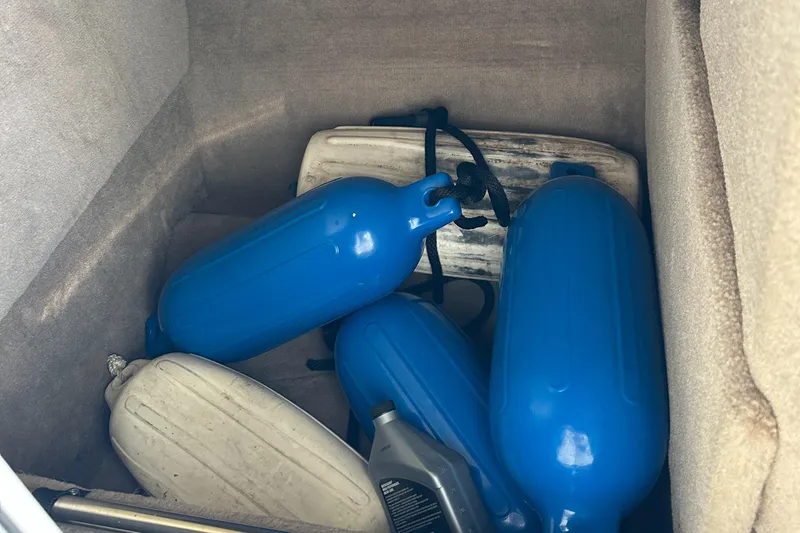 Slide: The Image of Blue boat fenders and accessories in a Chaparral 263 Sunesta storage compartment, 2002 model. - 25