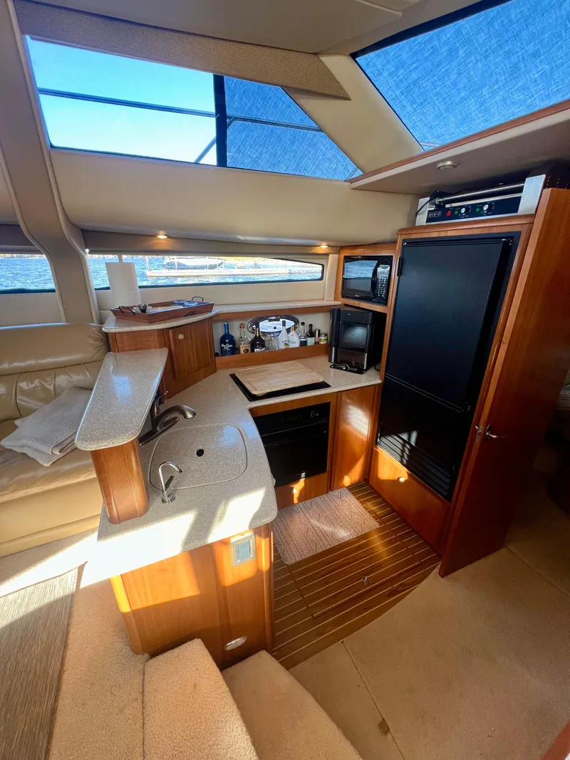 Slide: The Image of Interior of 2004 Meridian 459 Motoryacht with luxurious seating and modern amenities. - 15