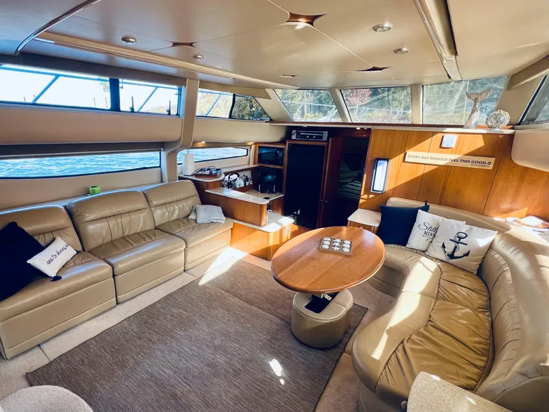 Slide: The Image of Luxurious interior of a 2004 Meridian 459 Motoryacht with plush seating and elegant wood finishes. - 9