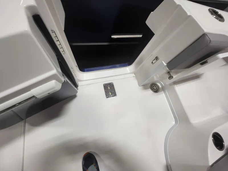 Slide: The Image of Interior view of a 2022 Fountain 38 SC boat, showcasing sleek white surfaces and modern design. - 12