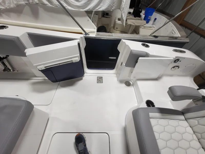Slide: The Image of 2022 Fountain 38 SC boat interior with seating and open door. - 15