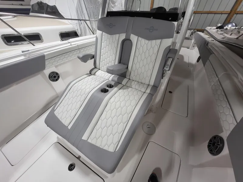 Slide: The Image of 2022 Fountain 38 SC boat interior with stylish gray and white seating. - 19
