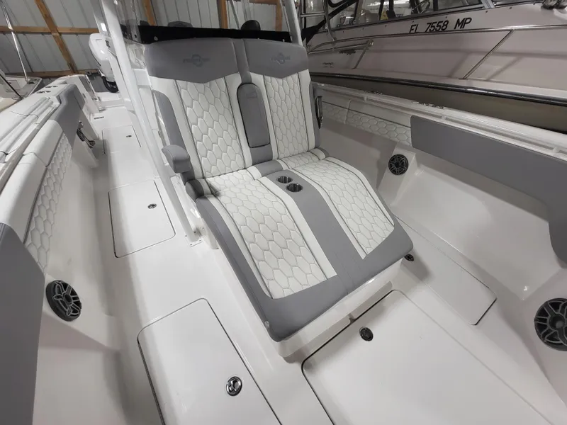 Slide: The Image of 2022 Fountain 38 SC boat interior with stylish seating and modern design. - 22