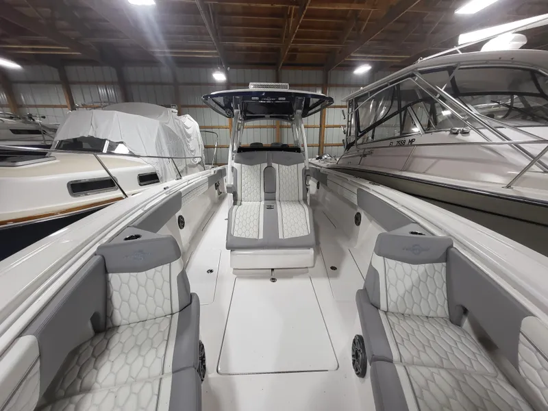 Slide: The Image of 2022 Fountain 38 SC boat in storage, featuring sleek design and comfortable seating. - 23