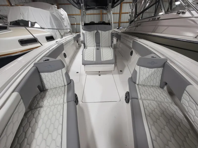 Slide: The Image of 2022 Fountain 38 SC boat interior with sleek seating and modern design. - 24