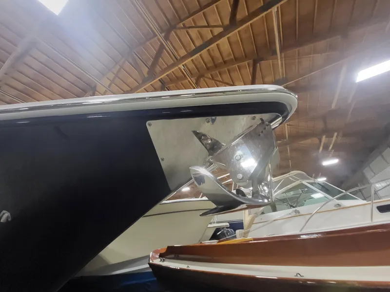 Slide: The Image of 2022 Fountain 38 SC boat in indoor storage, showcasing sleek bow design. - 3