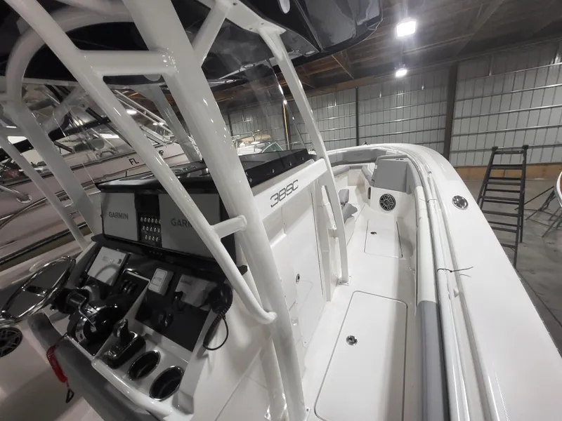 Slide: The Image of 2022 Fountain 38 SC boat interior with control panel and seating area. - 31