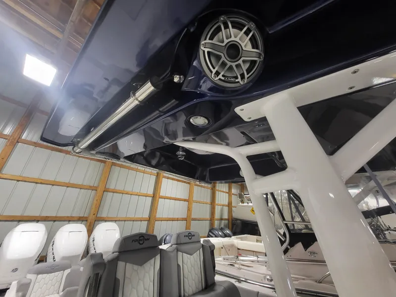 Slide: The Image of 2022 Fountain 38 SC boat interior with seating and speaker system. - 33