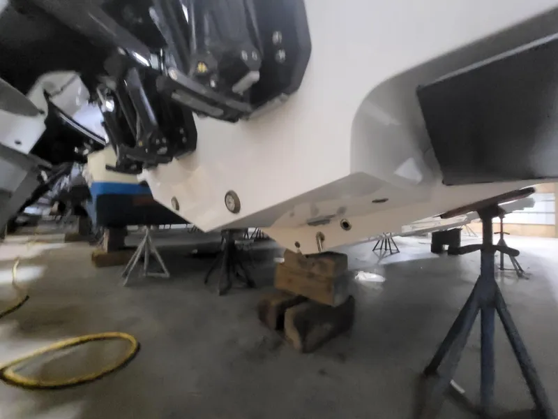 Slide: The Image of 2022 Fountain 38 SC boat on stands in a garage setting. - 7